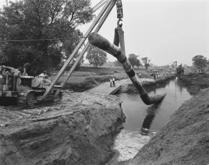 Prints of Barlaston, Stafford, Staffordshire. A view of the Barlaston pipeline crossing the Trent and Mersey Canal during the installation of the pipeline Engineering And Construction Prints: Print of the Barlaston pipeline crossing the Trent and Mersey Canal