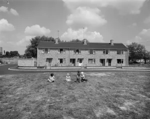 Prints of Sundew Close, Blackbird Leys, Oxford, Oxfordshire. A group of children playing on the grass infront of a row of terraced Easiform houses Engineering And Construction Prints: Blackbird Leys Terraced Houses Print