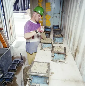 Prints of Glaxo Medical Research Centre, Gunnels Wood Road, Stevenage, Hertfordshire. A worker filling moulds with concrete during the construction of the Glaxo Research Centre in Stevenage Engineering And Construction Prints: Concrete Mould Print JLP01_11_53758