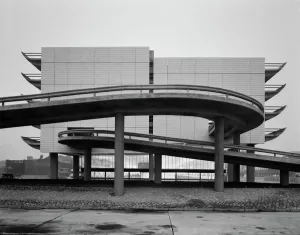 Prints of Preston Bus Station, Tithebarrn Street, Preston. End-on view showing the northern elevation with the car park decks protruding to either side. Photographed in October 1969; John Laing Collection Engineering And Construction Prints: Print of Preston Bus Station's Northern Elevation