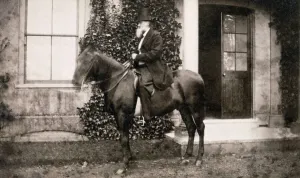 Print of Charles Darwin on horseback in a Kent landscape