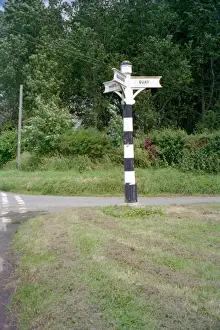 Print of a Tapered Hexagonal Wooden Signpost with Three Arms and Lettering