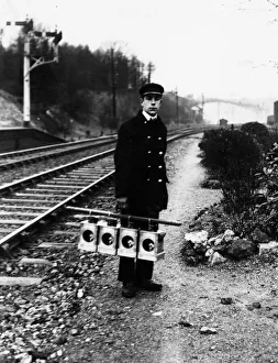 Signal lamp man servicing signal lanterns, c1930s Signal lamp man servicing signal lanterns, c1930s