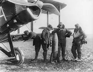 Aircrew of 27 Squadron examine a 230lb bomb Aircrew of 27 Squadron examine a 230lb bomb