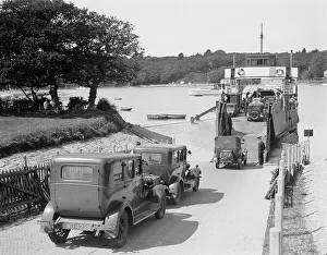 Cars and motorcycles arriving on board the ferry at Fishbourne, 1932 Cars and motorcycles arriving on board the ferry at Fishbourne, 1932