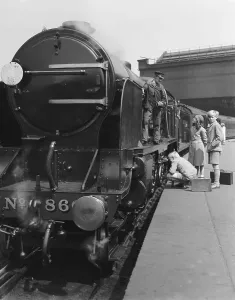 Waterloo Station Prints: Print of Three Children and a Locomotive Driver at Waterloo Station 1934