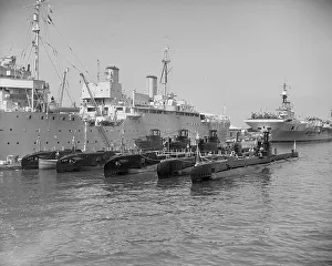 Submarines with their depot ship Submarines with their depot ship