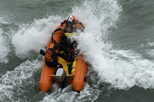 An arancia inshore rescue boat in heavy surf at Perranporth An arancia inshore rescue boat in heavy surf at Perranporth