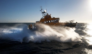 Arklow Trent class lifeboat Ger Tigchelaar 14-19 . Lifeboat moving from left to right at speed, lots of white spray Arklow Trent class lifeboat Ger Tigchelaar 14-19 . Lifeboat moving from left to right at speed, lots of white spray