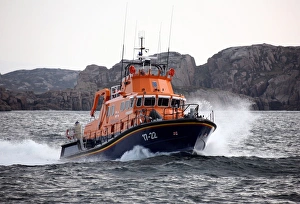 Arranmore severn class lifeboat Mrytle Maud 17-22 moving from left to right at speed, cliffs in the distance Arranmore severn class lifeboat Mrytle Maud 17-22 moving from left to right at speed, cliffs in the distance