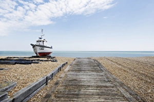 Landscape shot of fishing vessel sat on Walmer beach Landscape shot of fishing vessel sat on Walmer beach