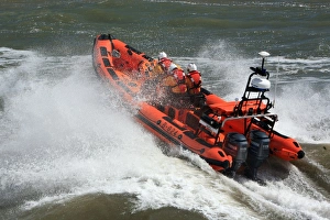 Minehead Atlantic 85 inshore lifeboat Richard and Elizabeth Deaves B-824. Lifeboat heading from away from the camera Minehead Atlantic 85 inshore lifeboat Richard and Elizabeth Deaves B-824. Lifeboat heading from away from the camera