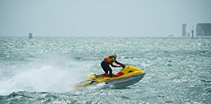 RNLI lifeguard on a rescue watercraft off Sandbanks beach, Poole RNLI lifeguard on a rescue watercraft off Sandbanks beach, Poole