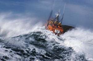 St Davids Tyne class lifeboat Garside 47-026 in rough seas. Three crew can be seen at the upper steering position St Davids Tyne class lifeboat Garside 47-026 in rough seas. Three crew can be seen at the upper steering position