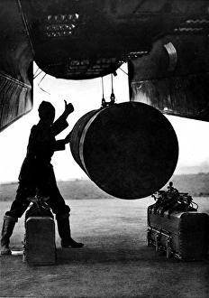 4000-lb Bomb being loaded into a Lancaster, Britain; Second 4000-lb Bomb being loaded into a Lancaster, Britain; Second