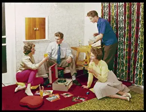 Prints of Four smartly-dressed teenagers having cocktails around a record player Historical Fashion Trends Prints: 60s Teenagers Around a Record Player Print