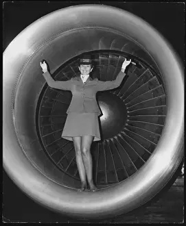 Prints of An air hostess stands on a DC-10 Laker Skytrain at London Gatwick Airport, Surrey, England. Launched in 1977, the (Freddie). Laker Skytrain flew from London to New York Aviation Prints: Air Hostess on DC-10 Laker Skytrain Print