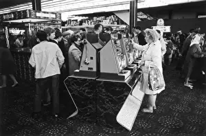 Amusement Arcade Scene Print: Blackpool Holidaymakers at Slot Machines