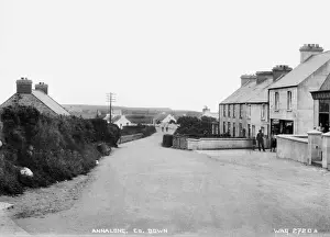 Prints of Annalong, Co. Down - a view of the village with shop fronts and people outside. (Location: Northern Ireland; County Down; Annalong). Date: circa early 1900s Down Prints: Early 20th Century Print of Annalong Village, Co. Down