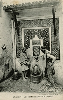 Arabs at a water fountain in Algiers, Algeria Arabs at a water fountain in Algiers, Algeria