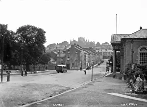Prints of Armagh - a street scene with motor bus, cars and people. In the distance is the Cathedral. (Location: Northern Ireland; County Armagh; Armagh). Date: circa early 1900s Armagh Prints: Armagh Street Scene Print, Early 1900s, Northern Ireland