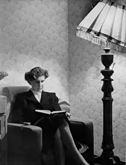 Armchair Reader Print: Woman Reading Under Standard Lamp