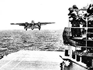 Prints of Photograph showing an American B-25 Mitchell medium bomber taking off from the aircraft carrier Hornet on 18th April 1942 Airplanes And Aviation Prints: B-25 Mitchell Bomber Taking Off from USS Hornet Print 1942