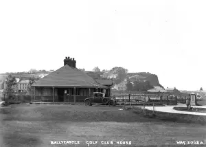 Prints of Ballycastle Golf Club House - a view of the clubhouse and Castle Hill behind. There is a motor car in the picture. (Location: Northern Ireland; County Antrim; Ballycastle). Date: circa early 1900s Sport Prints: Early 20th Century Print of Ballycastle Golf Club House