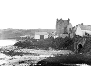 Prints of Ballygally Castle - a low view of the castle and coast road taken from the shore, by the bridge. (Location: Northern Ireland; County Antrim; Ballygalley). Date: circa early 1900s Castle Prints: Ballygally Castle Print: Early 20th Century View