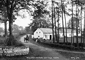Prints of Ballymatoskry Cottage, Toome - a view of a large cottage and to the left a horse vehicle, with passengers on a country road. (Location: Northern Ireland: County Londonderry: Toomebridge) Related Prints: Early 20th Century Print of Toomebridge Cottage