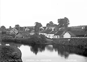 Prints of Ballynameen, Garvagh, Co. Londonderry - a view of a hamlet beside a river, some of the buildings are thatched. (Location: Northern Ireland; County Londonderry; Ballynameen). Date: circa early 1900s Related Prints: Early 20th Century Print of Ballynameen, Co. Londonderry