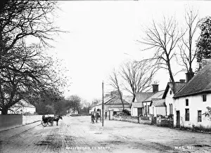 Prints of Ballyronan, Co. Derry - a rural village street with horse vehicle on the road. (Location: Northern Ireland: County Tyrone: Ballyronan). Date: circa early 1900s County Londonderry Prints: Early 20th Century Print of Ballyronan Village Street
