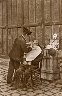 Barber in action, Rouen, Normandy, Northern France Barber in action, Rouen, Normandy, Northern France