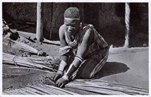 A Basotho woman making mats - South Africa A Basotho woman making mats - South Africa