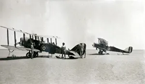 Two biplanes with resting crew, Iraq Two biplanes with resting crew, Iraq