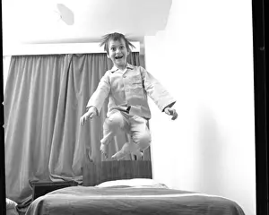 Boy Bouncing on a Bed Print