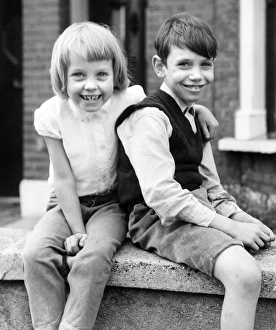Boy and girl on a street in Balham, SW London Boy and girl on a street in Balham, SW London