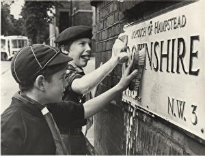 Boy Scouts cleaning street sign, London Boy Scouts cleaning street sign, London