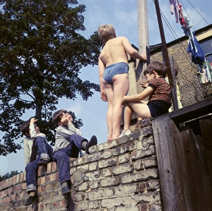 Four boys on a wall, with washing, Balham, SW London Four boys on a wall, with washing, Balham, SW London