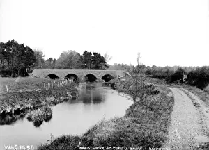 Prints of Braid Water at Currell Bridge, Ballymena - a view along a river to a bridge. (Location: Northern Ireland: County Antrim: Ballymena). Date: circa early 1900s River Prints: Braid Water at Currell Bridge Print, Ballymena, Northern Ireland
