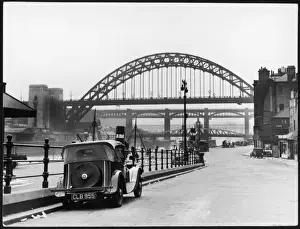 Prints of The handsome bridges connecting Gateshead and Newcastle-upon-Tyne. The Great Tyne Bridge arches over Stephensons High Level Bridge, a double-decker built in 1846 County Down Prints: Print of Bridges on the Tyne: A Double-Arched Icon