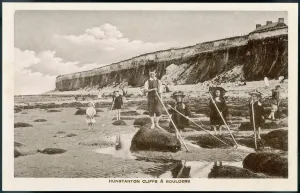 Prints of A group of children shrimping among the Boulders on the beach at Hunstanton, Norfolk Norfolk Prints: Hunstanton Beach Shrimping Print