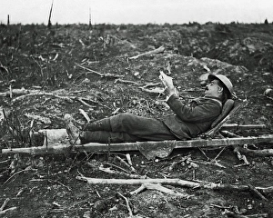 British soldier relaxing on a stretcher, Somme, WW1 British soldier relaxing on a stretcher, Somme, WW1