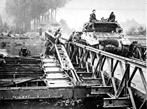 British Tanks crossing a Bailey Bridge, Holland; Second Worl British Tanks crossing a Bailey Bridge, Holland; Second Worl
