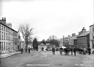 Prints of Broad St. Magherafelt - a street scene with people and horse vehicles. (Location: Northern Ireland: County Londonderry: Magherafelt). Date: circa early 1900s County Londonderry Prints: Early 20th Century Magherafelt Street Scene Print