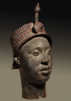 Bronze head with beaded crown and plume. 12th-14th Bronze head with beaded crown and plume. 12th-14th
