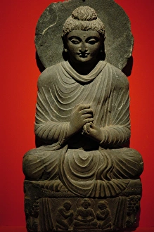 Buddha statue with dharmachakra mudra gesture. 2nd-3rd centu Buddha statue with dharmachakra mudra gesture. 2nd-3rd centu