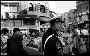 Busy street with policeman Alexandria, Egypt Busy street with policeman Alexandria, Egypt