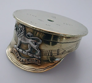 A cap with a Herefordshire Regiment badge A cap with a Herefordshire Regiment badge