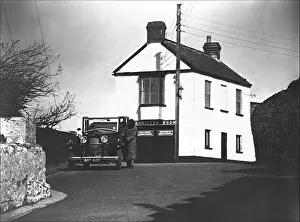 Prints of A Vauxhall Cadet car and its driver in front of a large white house in Irsha Street, Appledore, Devon Appledore Prints: Appledore, Devon: Vauxhall Cadet Car and House Print